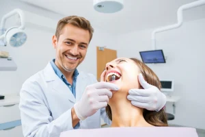 A calm, modern dental clinic interior with a smiling dentist in a white coat gently placing a dental implant into a patient's jaw, soft natural lighting, clean white and light blue color scheme, medical equipment subtly visible in background, no text or signs, focus on the precise, painless procedure