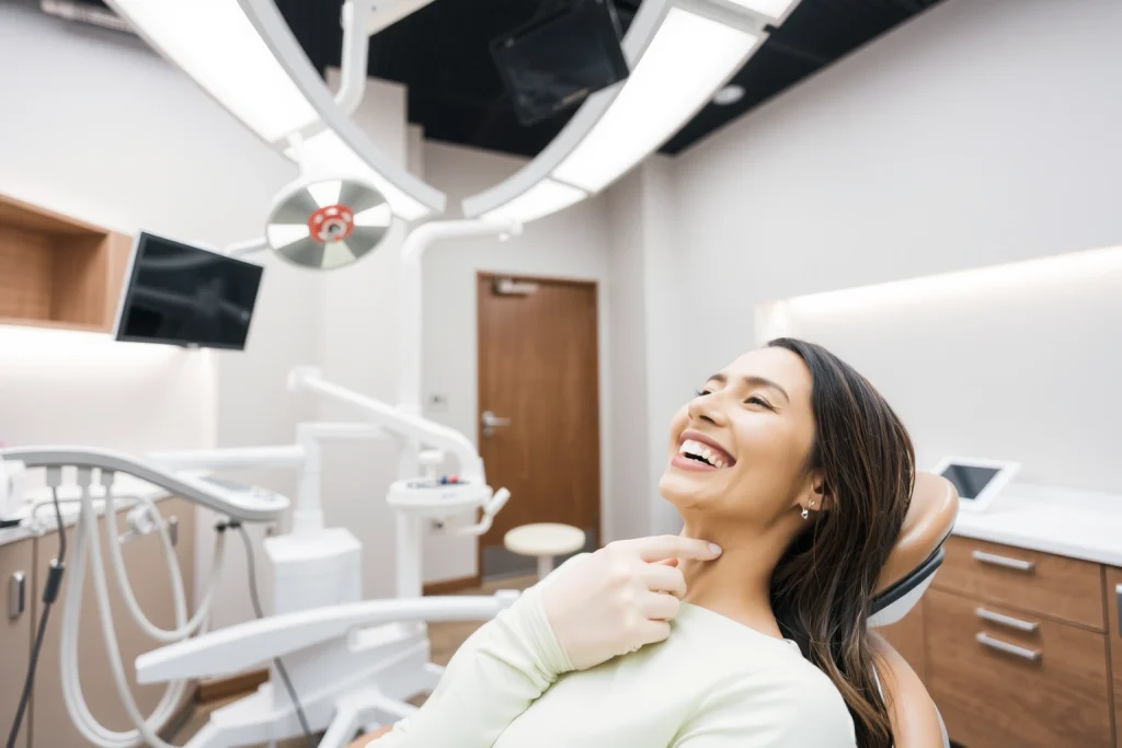 A professional dental clinic interior with a dentist examining a patient's smile, showing dental implants in a clean, modern setting with soft lighting, medical equipment, and a reassuring atmosphere