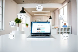 A modern digital workspace with a laptop displaying a website interface labeled 'Дьячкова Online', surrounded by subtle icons representing online education, video calls, and digital collaboration, in a clean, professional environment with soft natural lighting
