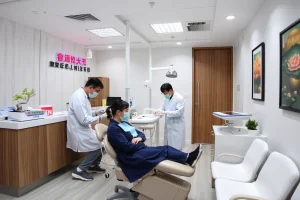 A modern dental clinic in China with Chinese dentists treating patients, showing advanced dental equipment, a reception desk with Chinese signage, and a waiting area with subtle cultural elements like a small bonsai plant and traditional artwork on the walls, all in bright, clean, professional lighting